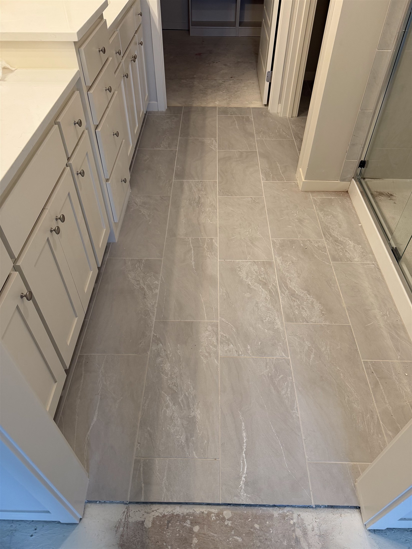 Natural-look tile floor installed by Heartland Tile